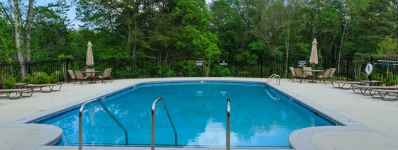 This image shows a pool with a newly resurfaced deck.