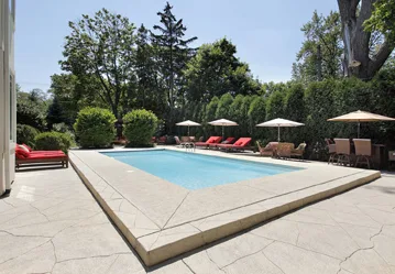 This image shows a pool with a newly resurfaced deck.