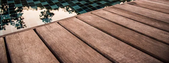 This image shows a pool with a newly resurfaced deck.