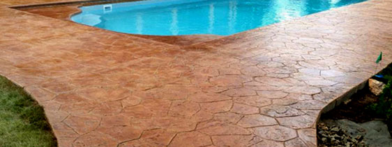 This image shows a stained concrete floor of a pool deck.