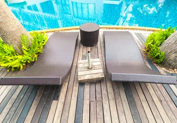 This image shows a pool with a newly resurfaced deck.