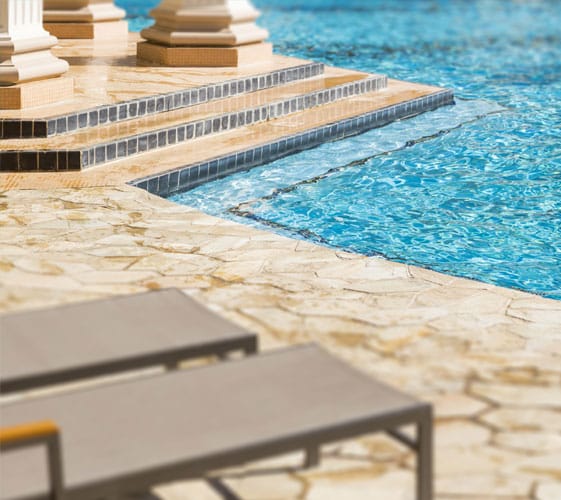 Stamped Concrete This image shows a pool with a newly resurfaced deck.