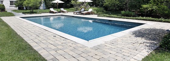 pool deck pavers This image shows a pool deck that will be resurfaced.