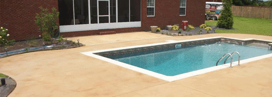 resealing This image shows a pool with a newly resurfaced deck.