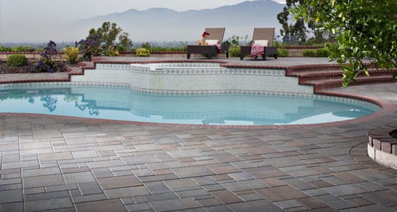 This image shows a pool with a newly resurfaced deck.