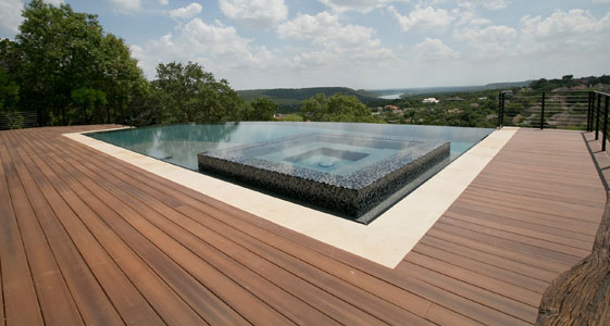 This image shows a pool with a newly resurfaced deck.