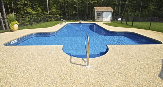 This image shows a pool with a newly resurfaced deck.