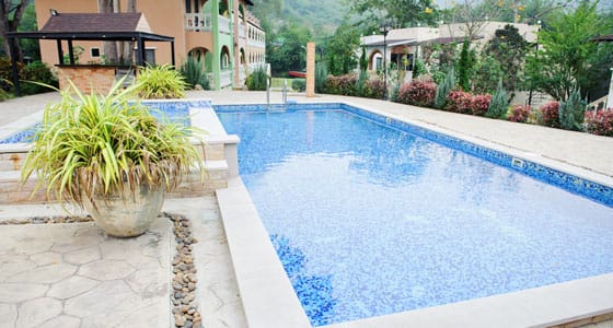 This image shows a pool with a newly resurfaced deck.