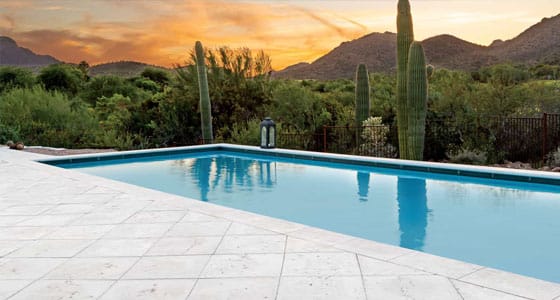 This image shows a pool with a newly resurfaced deck.
