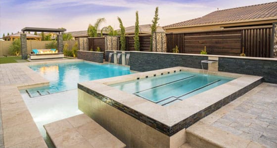 This image shows a pool with a newly resurfaced deck.