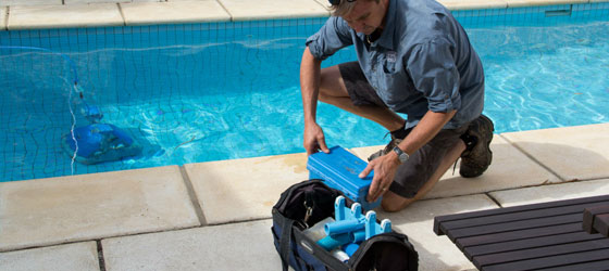 This image shows a man repairing a pool deck.