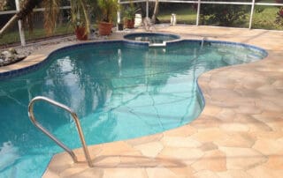 This image shows a pool with a newly resurfaced deck.