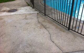 This image shows a cracked pool deck.