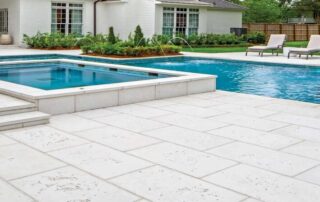 This image shows a stamped concrete pool deck.