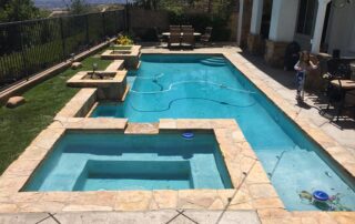 This image shows a pool deck that was resurfaced using stamped concrete.