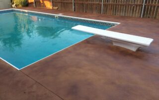 This image shows a pool deck with rubber deck coating.